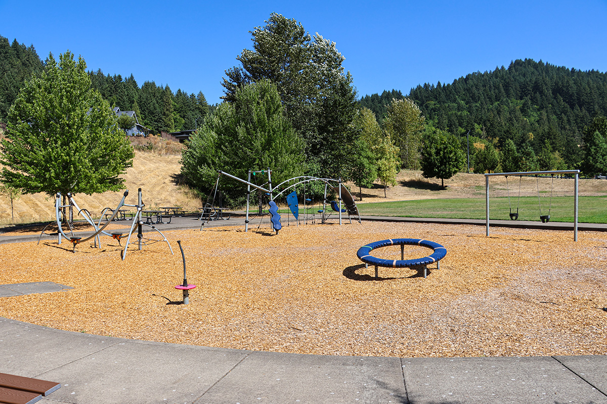 A playground and bark chips at Rob Adams Park 