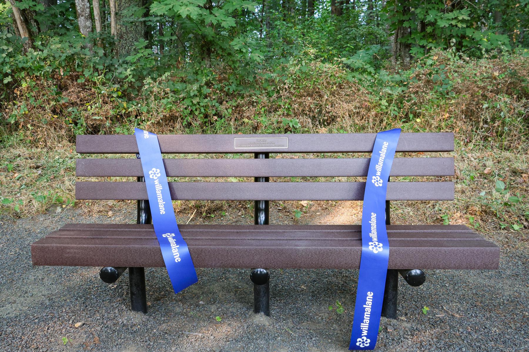 Willamalane ribbon rests on a newly dedicated bench