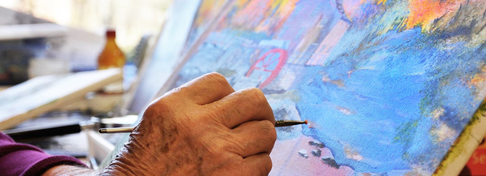 Close-up of paintbrush on canvas painting 
