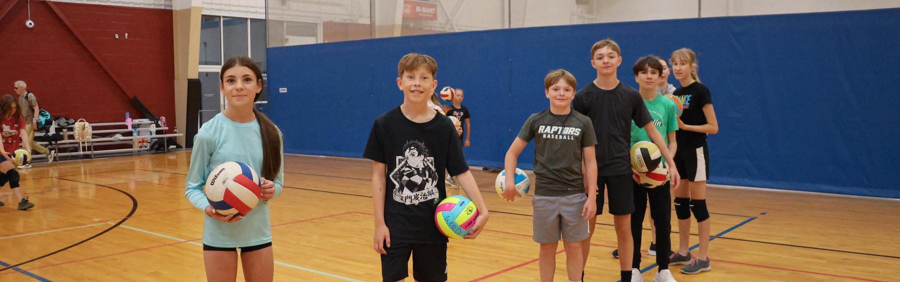 Middle schoolers at volleyball camp post for group image