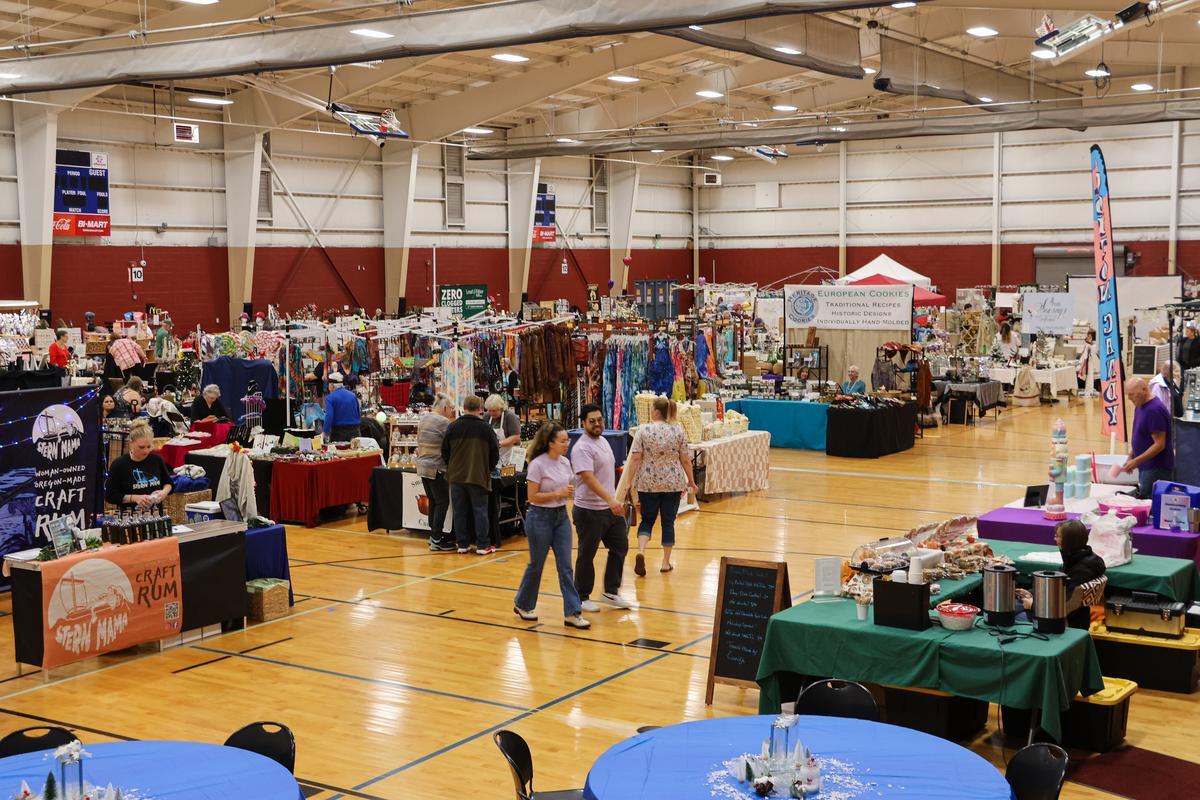 colorful booths line the floor with a variety of handcrafted goods.
