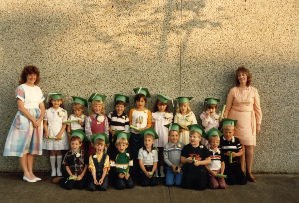 Students graduate preschool in 1980s