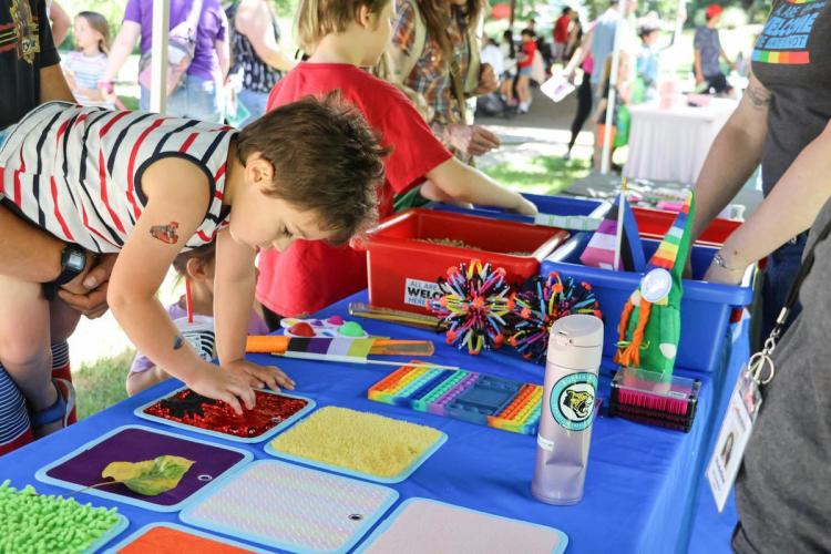 Young child playing at activity table