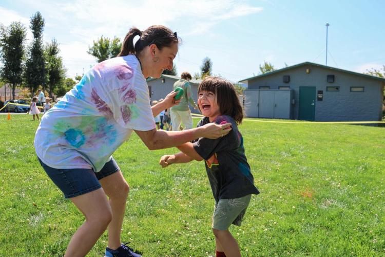 Adult and child smiling