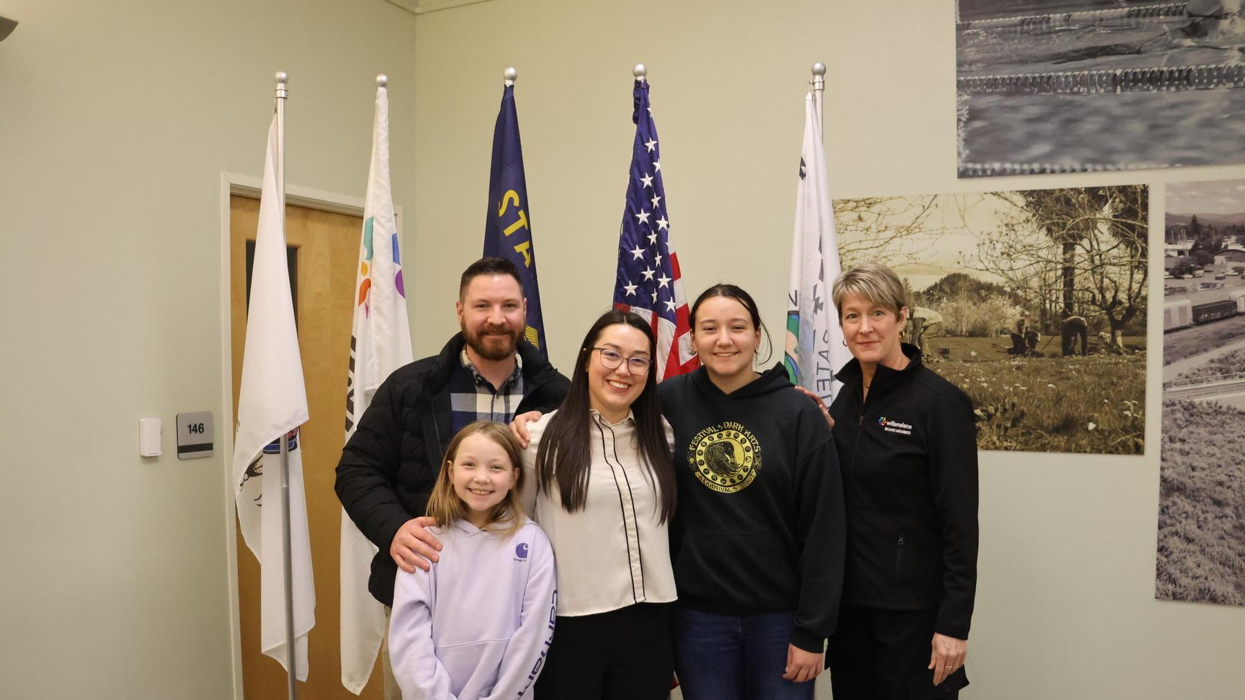 Director McCauley stands with her family and Vice President Muenchinger