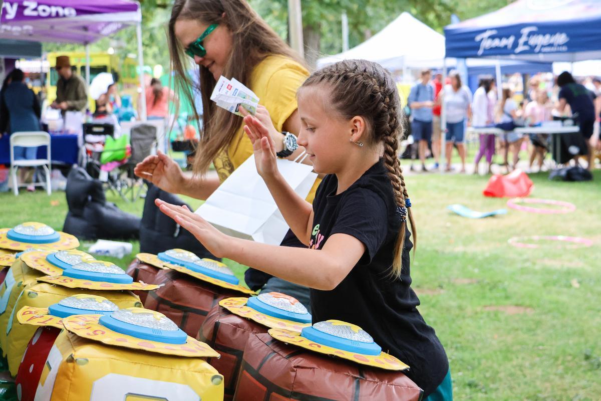 Child plays participates in activity at Children's Celebration