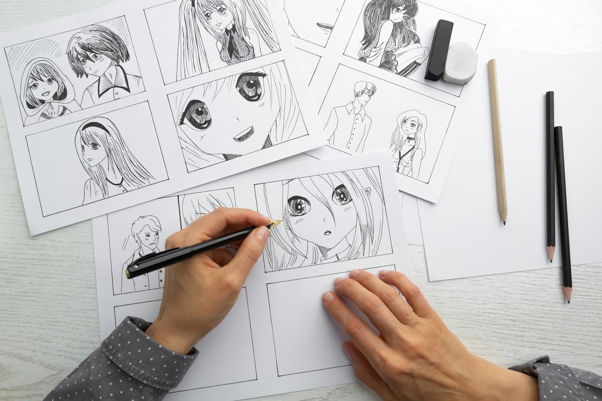 Hands drawing anime character