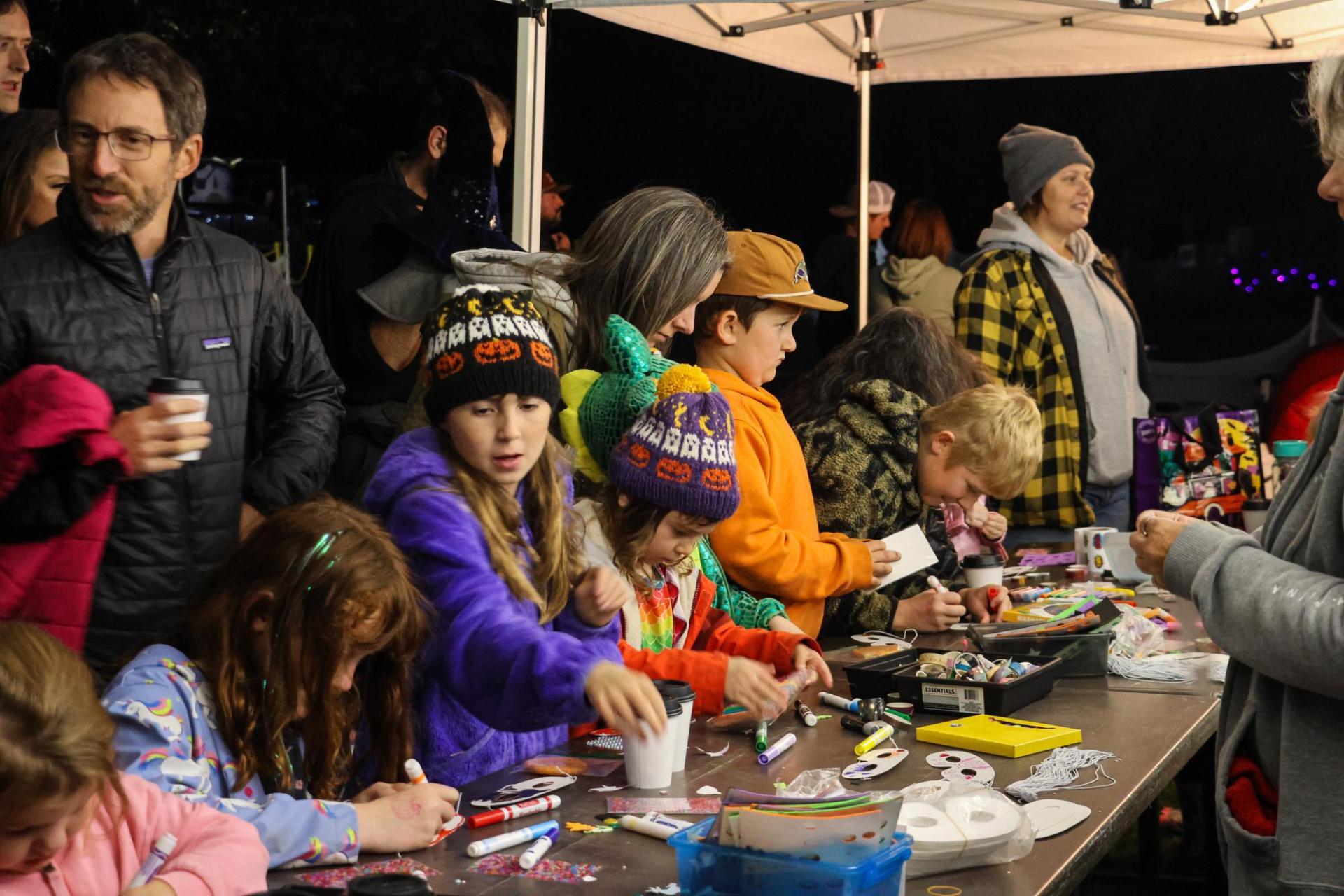 Kids doing crafts and activities at haunted hayride