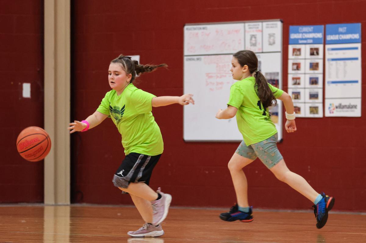 Young basketball player dribbling the ball