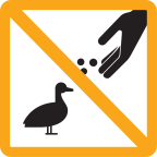 Hand feeding a duck with a prohibited slash